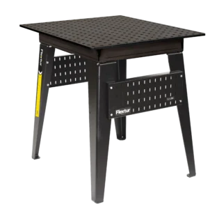 The 36" x 30" Nitride Welding Table is a black metal table with a perforated top, sturdy legs, Flextur branding on the side, and horizontal slotted panels for storing tools.